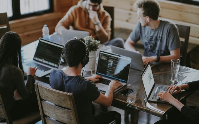 Colleagues working together on a software workflow