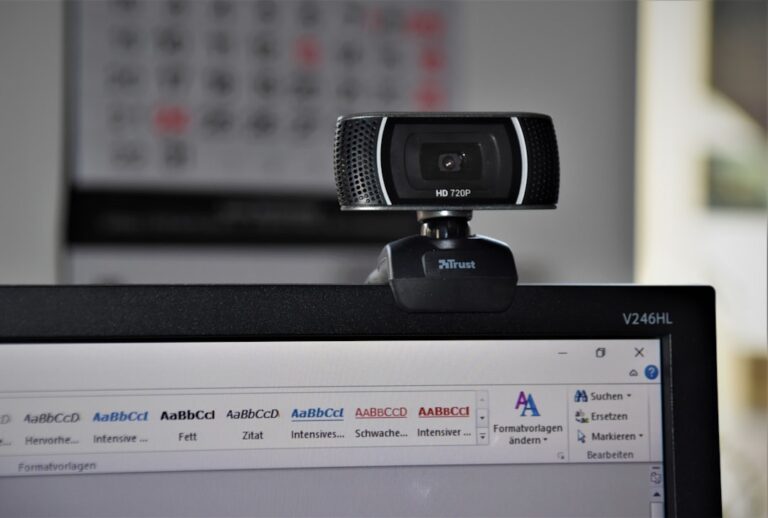 Compact webcam mounted above a computer monitor