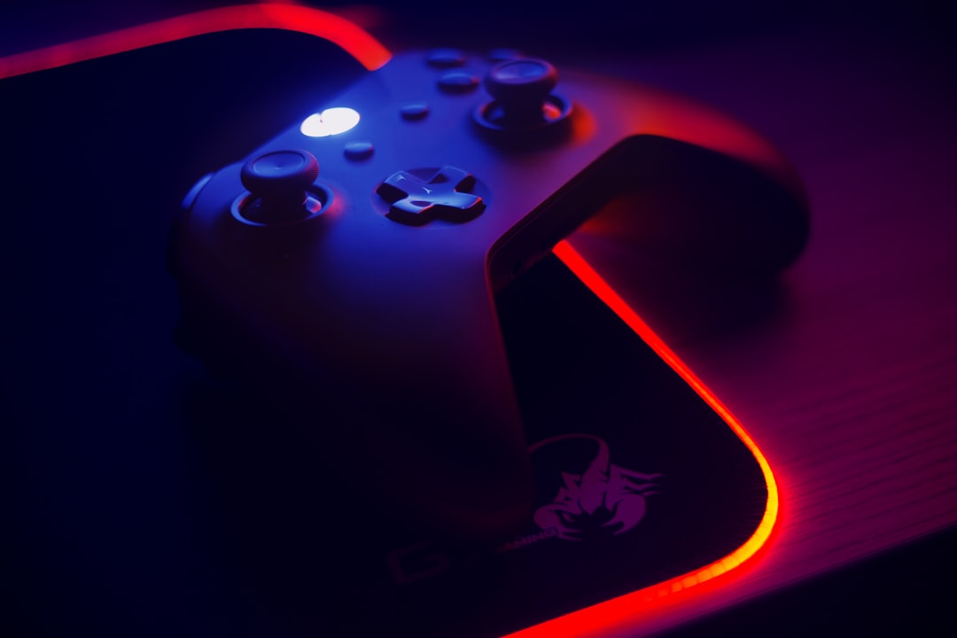 Game controller on an illuminated desk mat