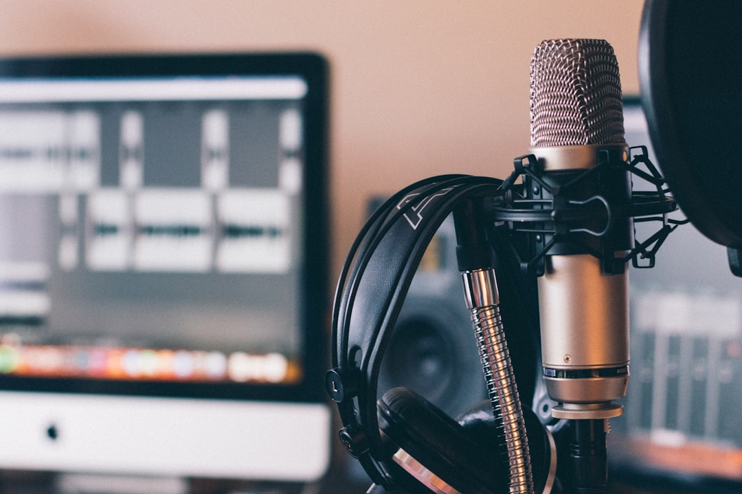 Microphone, headphones and recording software at a desk