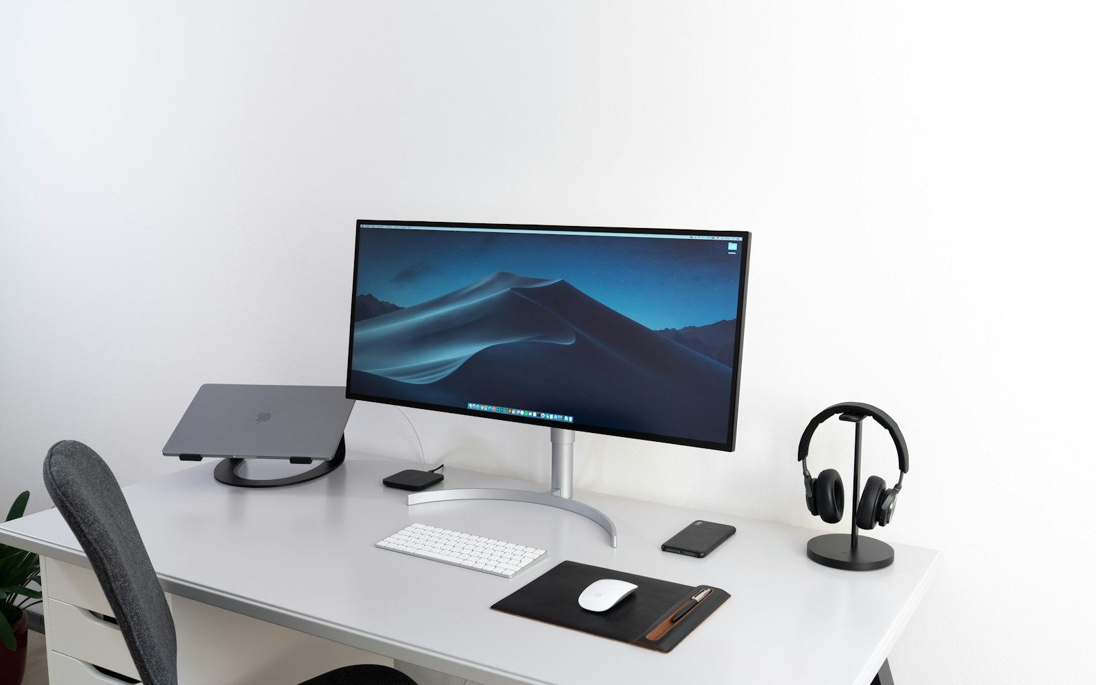 Desktop monitor, keyboard, and mouse arranged on a clean desk